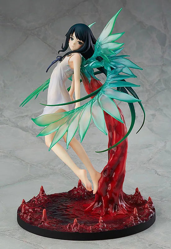 A dark-haired figure in a white dress posed on a red swirling base with green wing-like details.