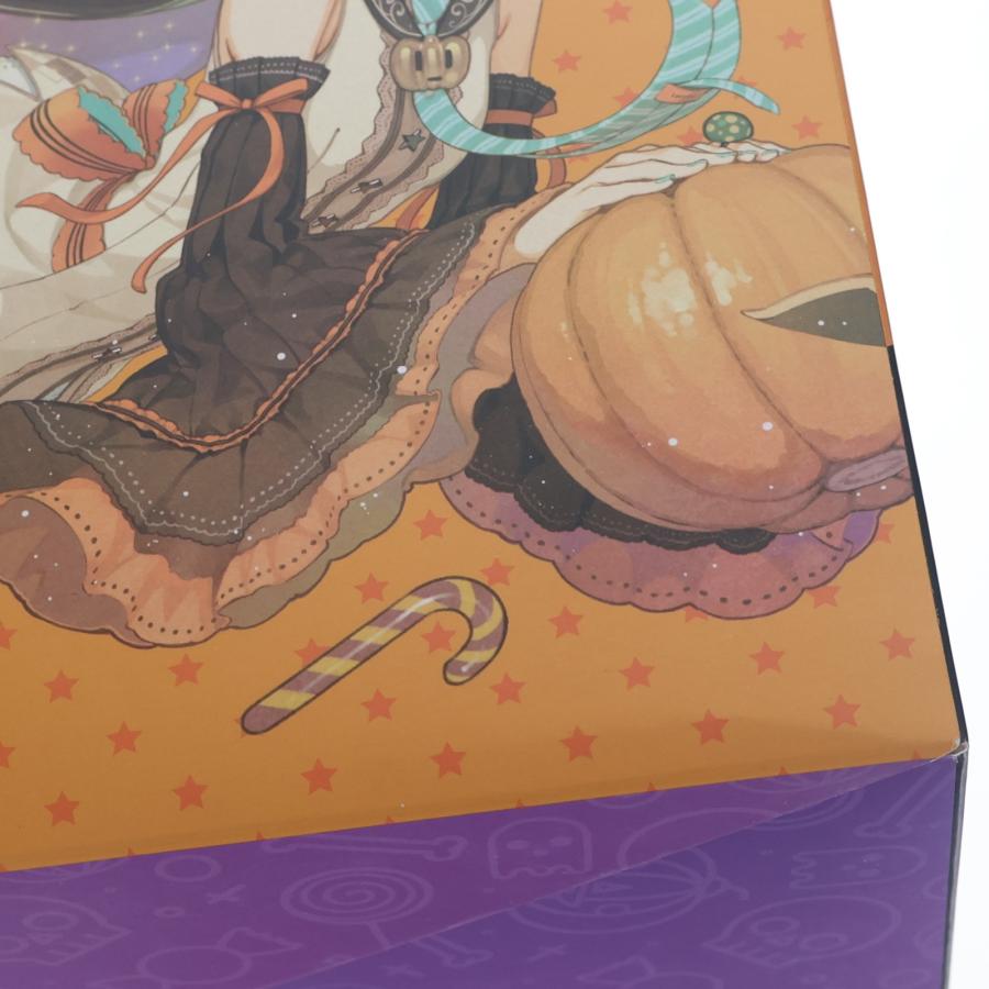 Close-up of a colorful figure box with Halloween-themed artwork and purple base panel.