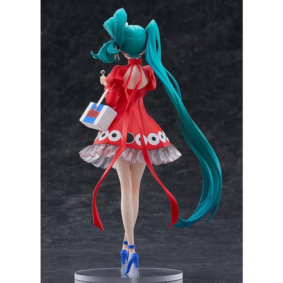 Back view of a Hatsune Miku figure in a red dress with long turquoise twin tails.