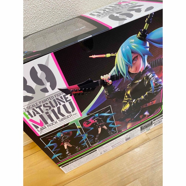 A boxed Hatsune Miku figure with colorful box art and a clear window on the top.