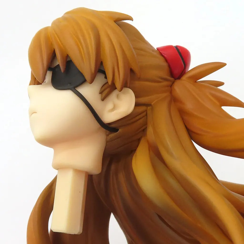 Close-up of an anime girl figure with brown hair and black sunglasses on a white background.