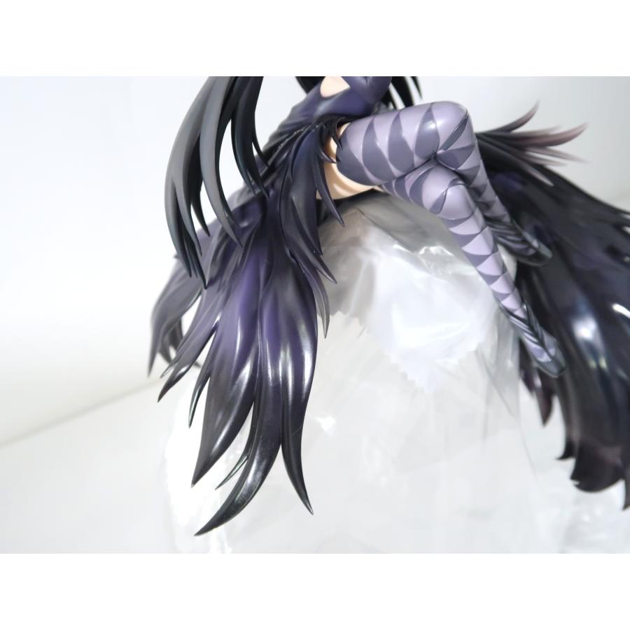 Close-up of a dark-haired figure with a purple patterned leg and flowing hair.
