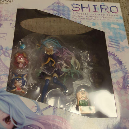 Opened figure still inside its box with plastic insert and accessories visible.