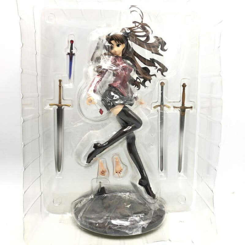 Anime figure of Tohsaka Rin in a clear plastic blister tray with swords and a base.