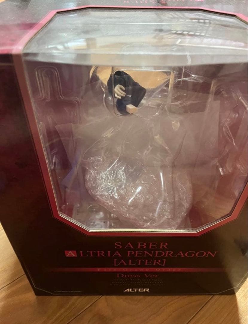 A boxed Saber Altria Pendragon Alter Dress Ver. figure with a clear window.