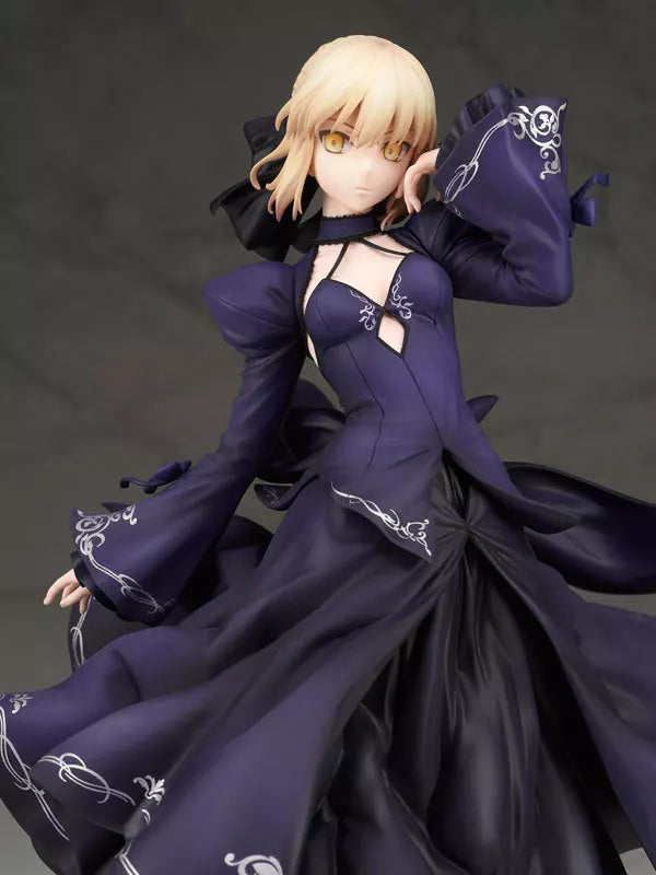 Blonde anime figure in a dark purple dress posing against a dark background