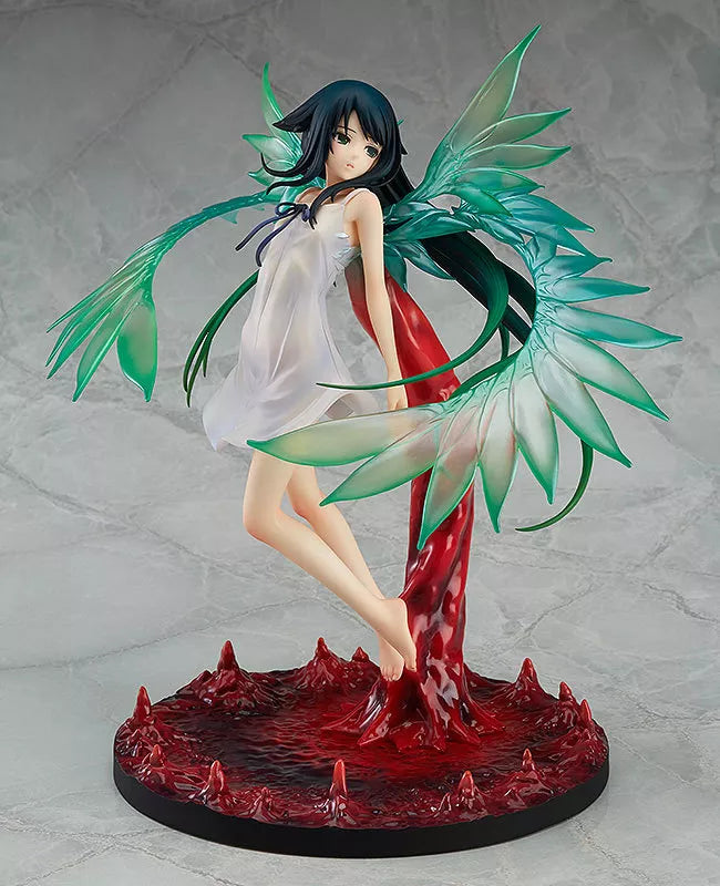 An anime girl figure with translucent green wing-like parts on a red base.