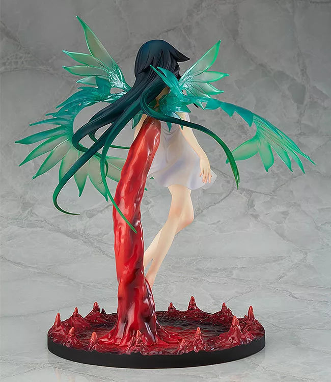 A winged figure with long dark hair stands on a red sculpted base against a gray backdrop.
