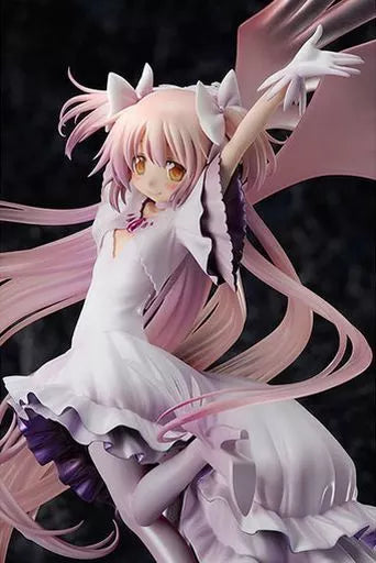 Pink-haired anime figure posed with outstretched wings on a dark background