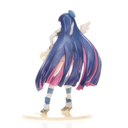 Back view of a blue-haired anime figure with long hair and a white background
