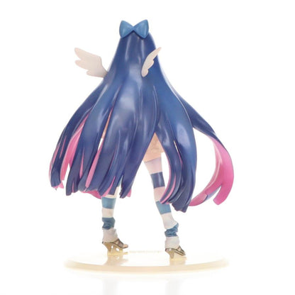 Back view of a blue-haired anime figure with a bow and wings on a white background