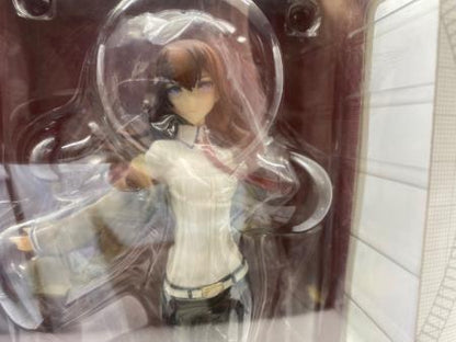 An anime figure of Makise Kurisu visible inside a clear plastic box window.