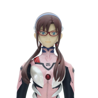 Close-up of a pink-and-black anime figure wearing red glasses on a white background.