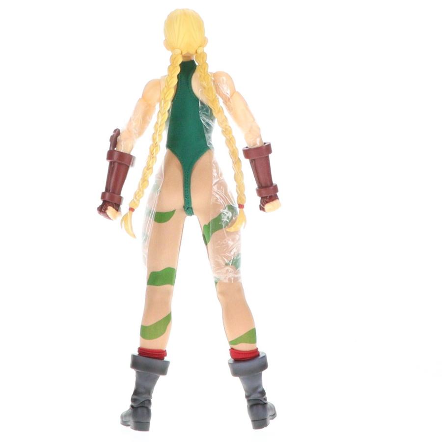 A blonde action figure seen from the back on a white background.