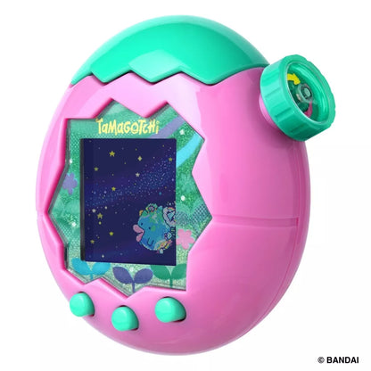 Pink and teal Tamagotchi device on a white background.
