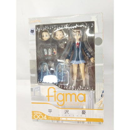 Front of boxed figma Ui Hirasawa in school uniform, with alternate faces and accessories visible.