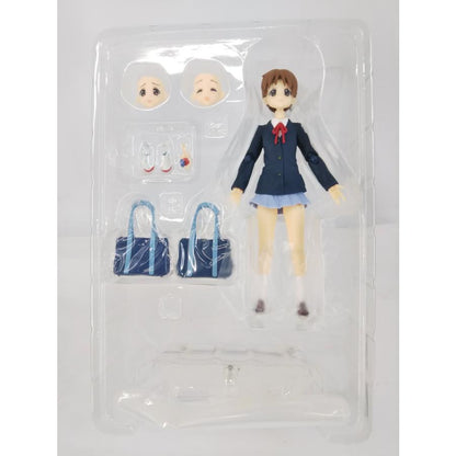 Ui Hirasawa school uniform figure in a clear blister with alternate faces, hands, school bags and stand.