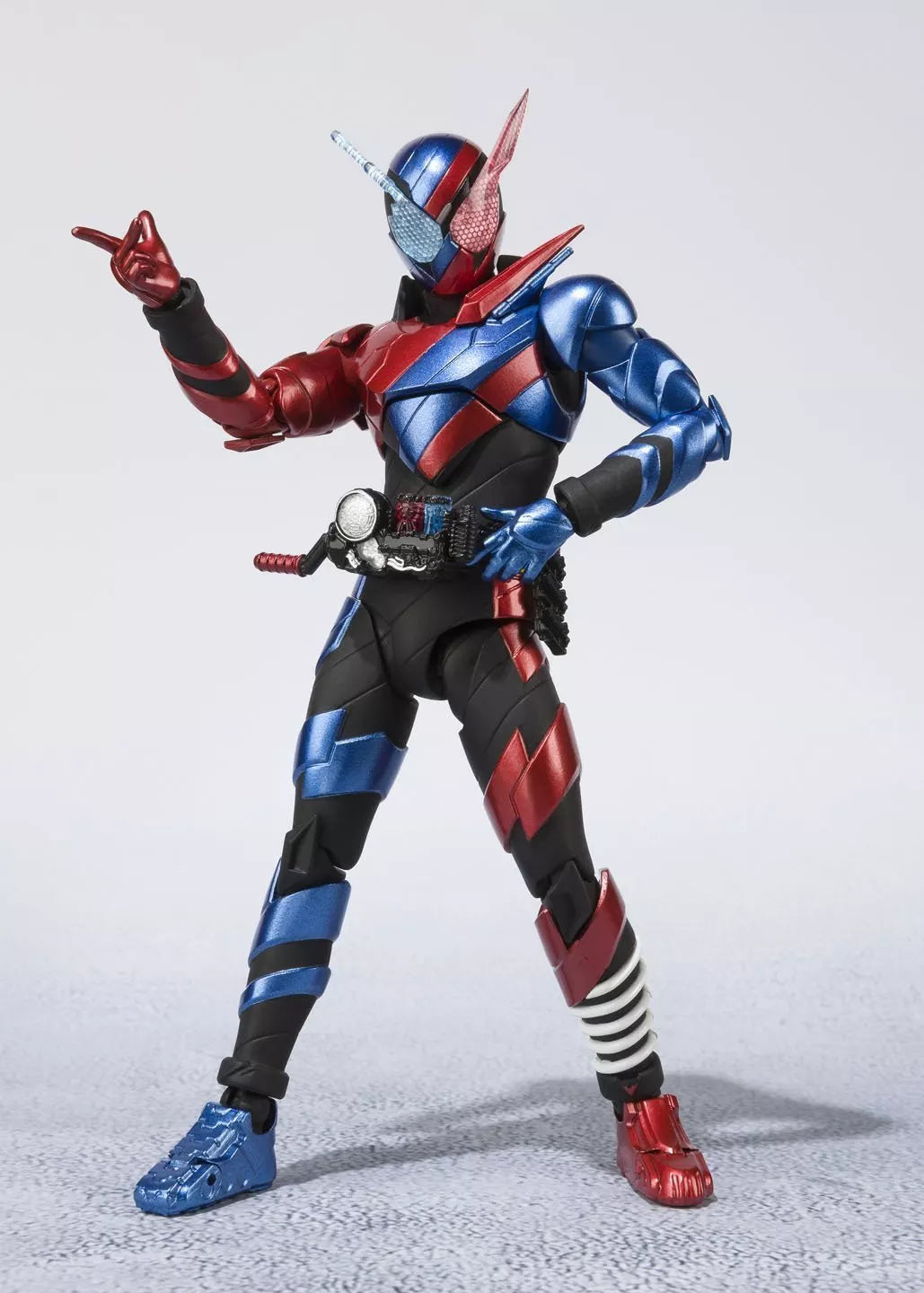 Kamen Rider Build Rabbit Tank Form figure posed with one hand raised against a light studio background.