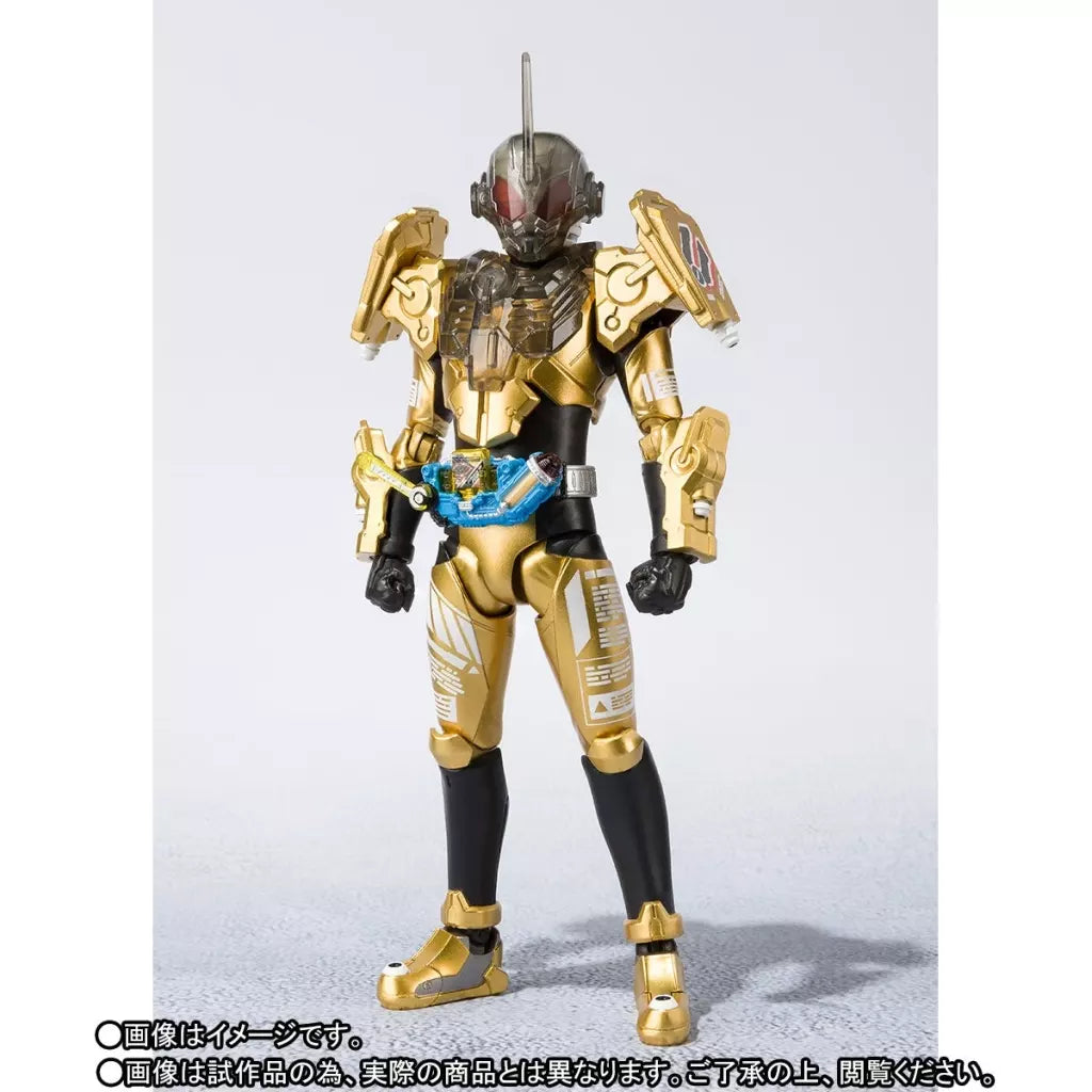 Kamen Rider Grease figure in gold and black armor with a blue belt, shown from the front.