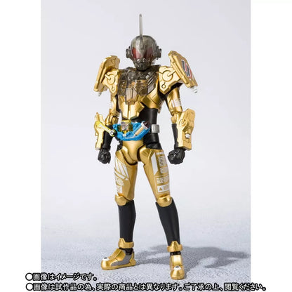 Kamen Rider Grease figure in gold and black armor with a blue belt, shown from the front.