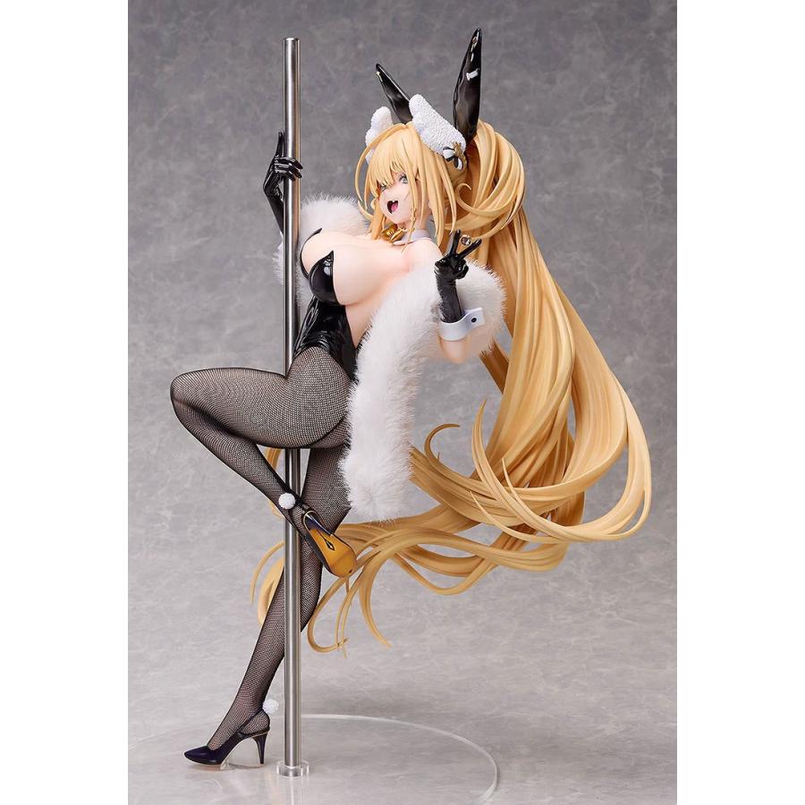 Blonde bunny figure in a black outfit and fishnet tights posing on a pole with a white fur wrap.