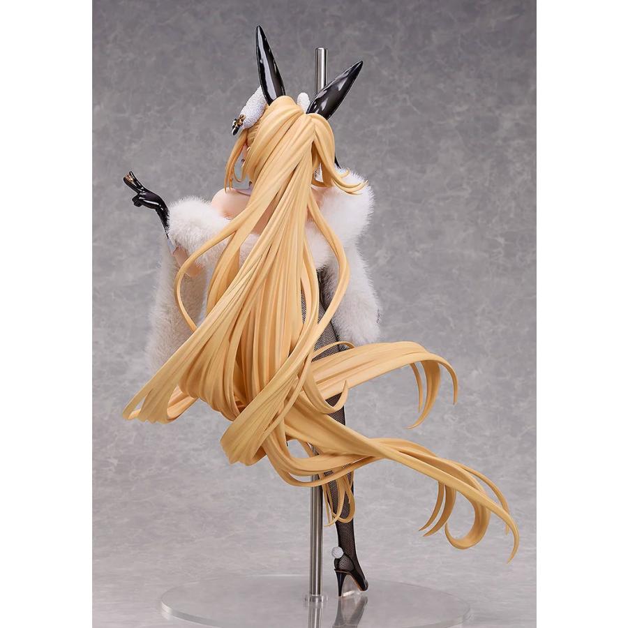 Rear view of a blonde bunny figure with long flowing hair, black ears, white fur wrap and a clear base.