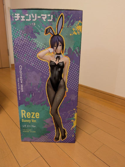 Reze Bunny Ver. figure retail box with purple and teal artwork standing on a wooden floor.