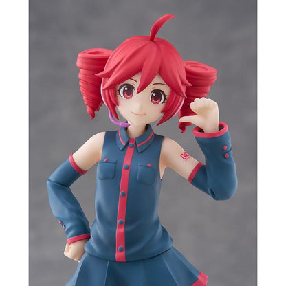 Close-up of Kasane Teto figure with red drill pigtails, blue outfit and raised hand against a gray background.