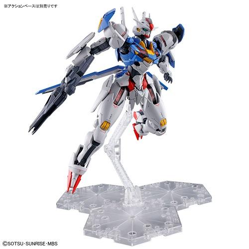 Gundam Aerial posed with a rifle and shield on a clear display stand against a white background.