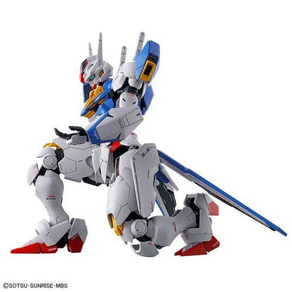 Gundam Aerial model in a kneeling side pose with white armor, blue panels, red feet and a long weapon.