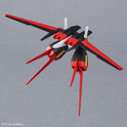 A red, black, and white model accessory part on a plain gray background.