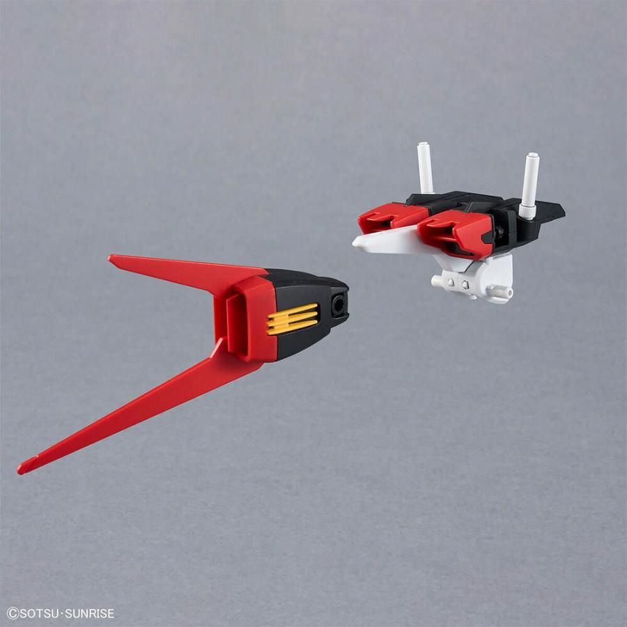 A close-up studio image of Gundam model parts on a gray background.