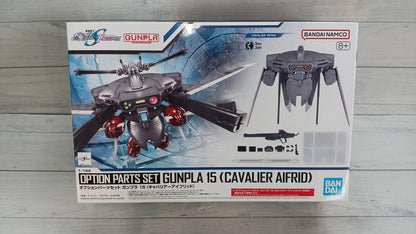 Front of an Option Parts Set Gunpla 15 Cavalier Aifrid box on a gray wood-patterned surface.