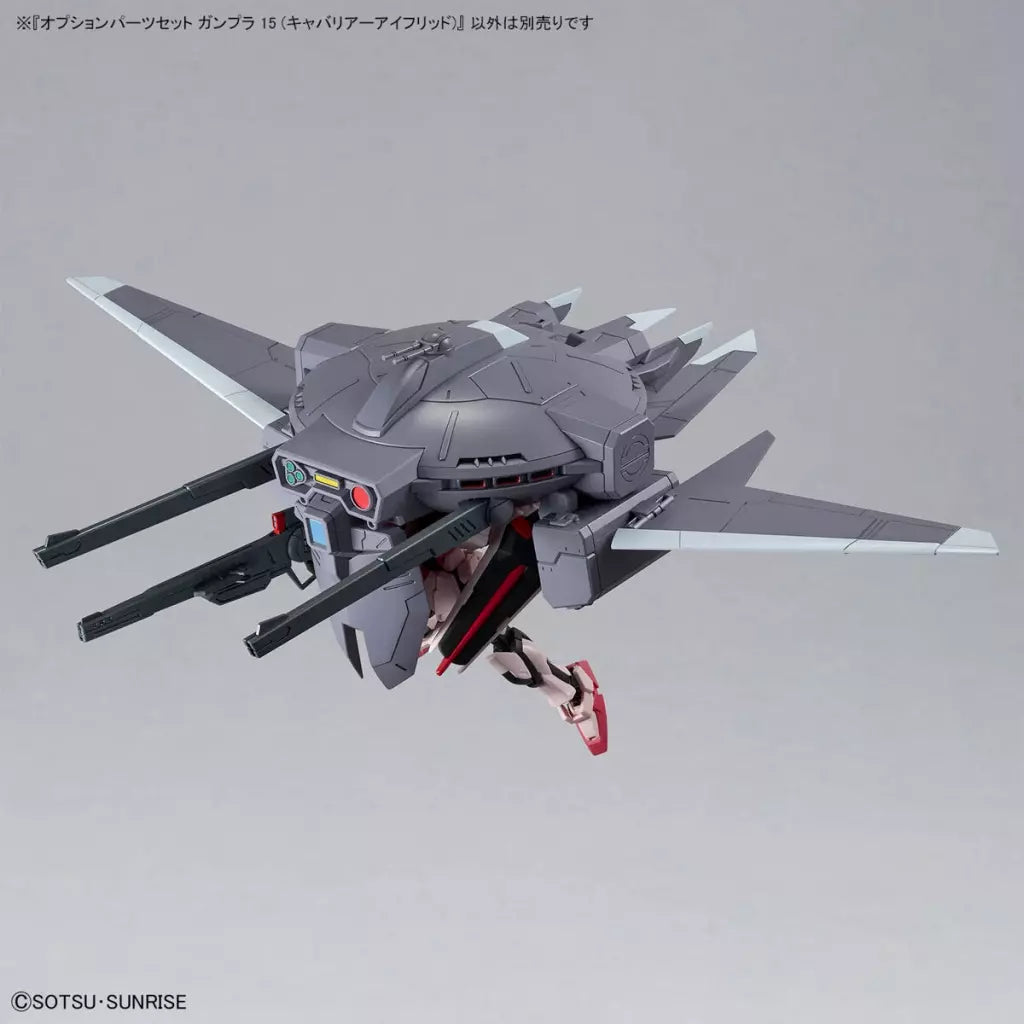 Gray Cavalier Aifrid support craft with broad wings and long cannons, shown attached to a Gundam model.