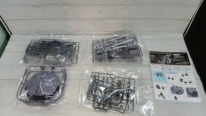 Bagged Cavalier Aifrid model kit runners and an instruction sheet laid out on a wood-patterned surface.