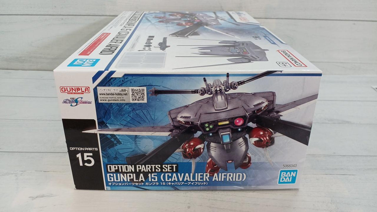 One Bandai Option Parts Set Gunpla 15 Cavalier Aifrid box on a pale wood-patterned surface.
