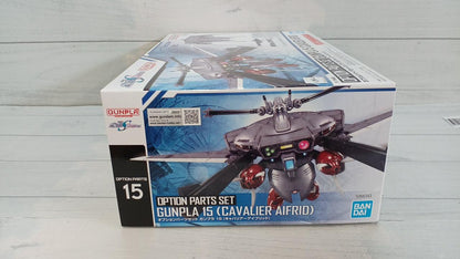 Gunpla Option Parts Set 15 Cavalier Aifrid retail box on a pale wood surface, with front and top visible.