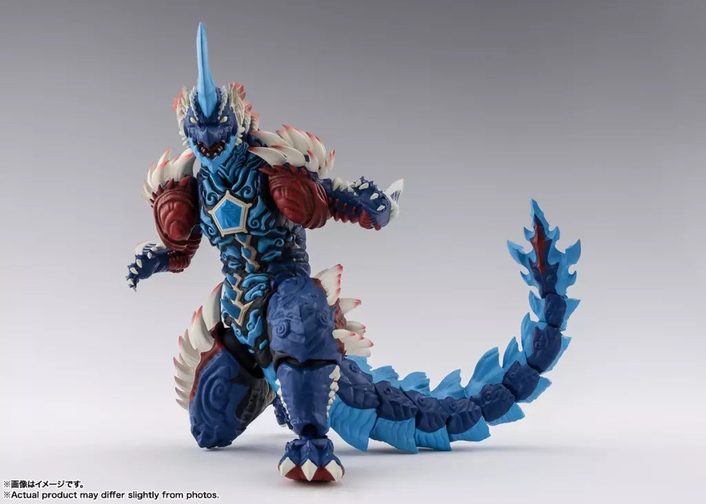 Blue horned monster figure with red shoulders, white spikes, and a long curved tail on a light background.