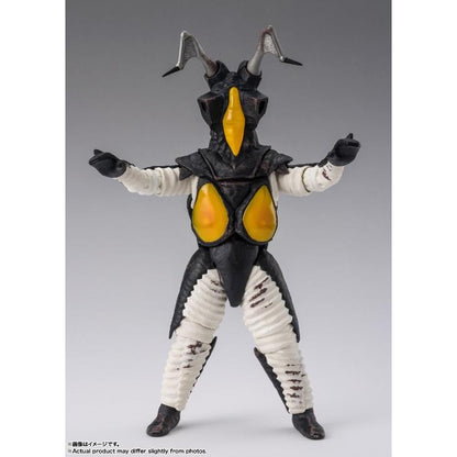 Zetton figure facing forward with raised arms, yellow facial and chest panels, against a gray studio backdrop.