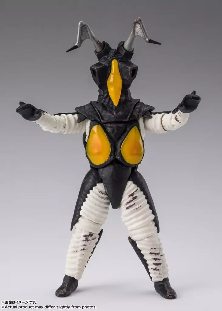 Front view of Zetton figure with raised arms, black armor, yellow chest panels and white limbs.