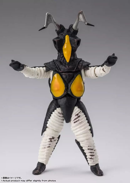 Front view of Zetton figure with raised arms, black armor, yellow chest panels and white limbs.