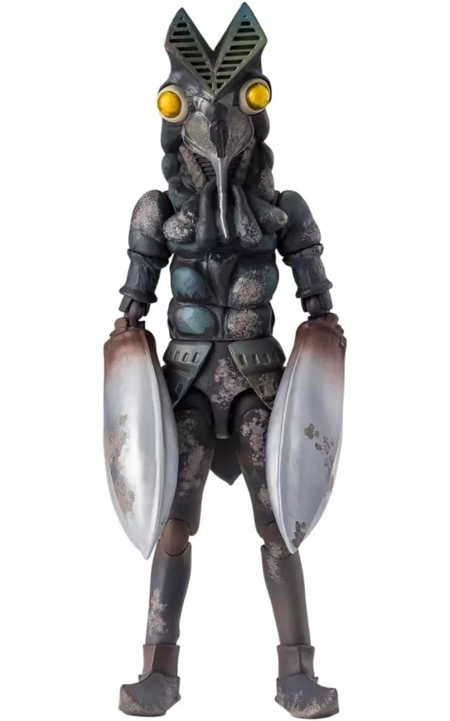 Front view of Alien Baltan figure with yellow eyes, large silver claws, and mottled dark body.