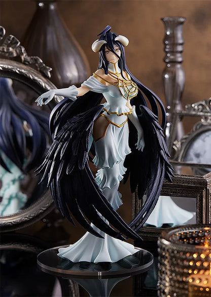 Albedo figure in a white dress with black wings on a round base, surrounded by mirrors and decorative objects.