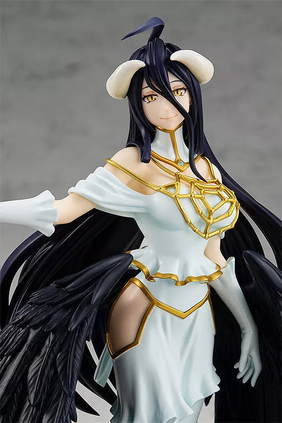 Close-up of Albedo figure with black hair, ivory horns, white and gold dress, and black wings.