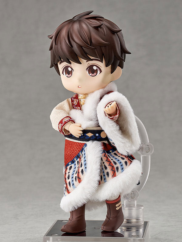 Brown-haired doll in a patterned outfit with white fur trim and brown boots on a clear display stand.