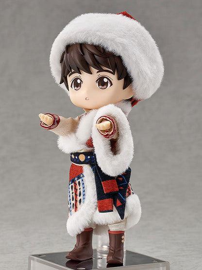Brown-haired doll in a fur-trimmed hat and patterned winter outfit, standing on a base against gray.