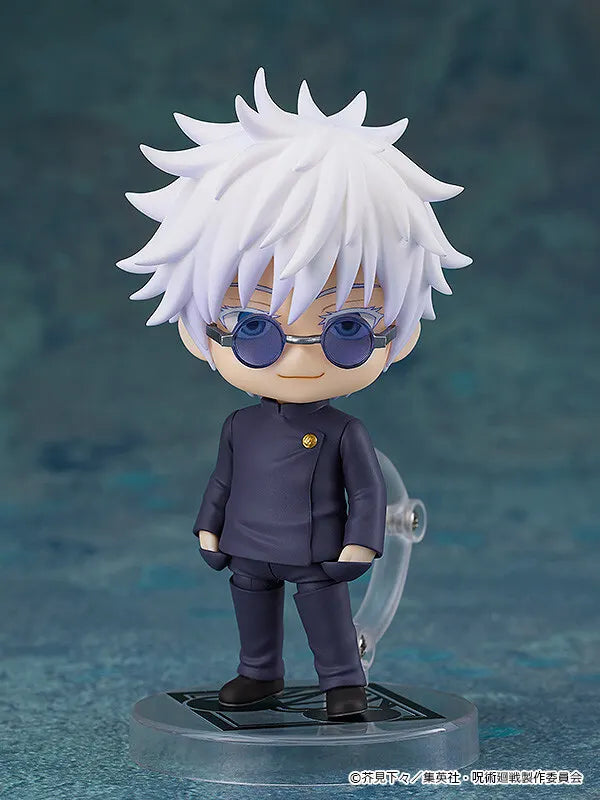 Satoru Gojo figure with white hair, round blue sunglasses and a dark school uniform on a clear display base.