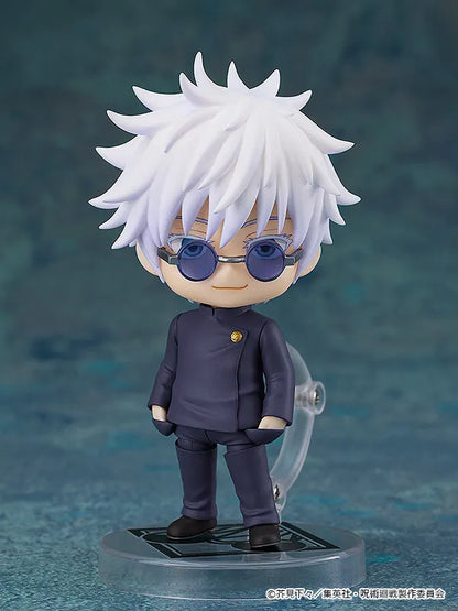 Satoru Gojo figure with white hair, round blue sunglasses and a dark school uniform on a clear display base.