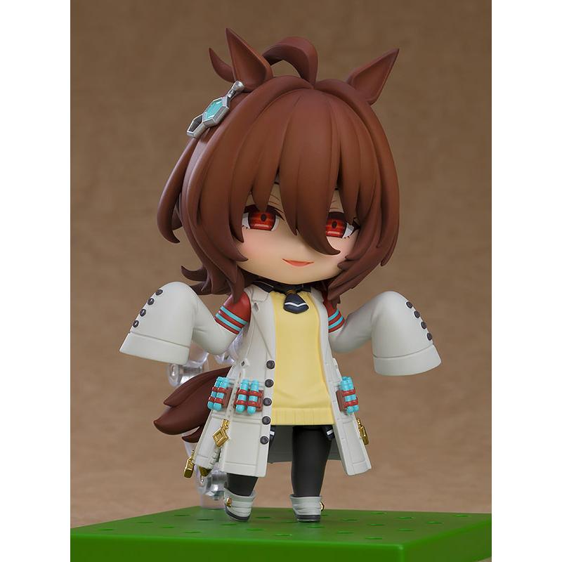 A Nendoroid-style Agnes Tachyon figure standing on a green base against a brown background.