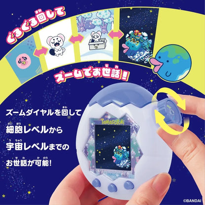 A Tamagotchi device is shown in a hand with a rotating dial and Japanese text.
